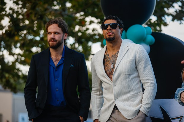 San Jose Sharks' Timothy Liljegren (37), left, and San Jose Sharks' Ryan Reaves (75), right, are introduced on stage during a pregame ceremony before the San Jose Sharks' home opener against the Vegas Golden Knights at the SAP Center in San Jose, Calif., on Thursday, Oct. 9, 2025. (Shae Hammond/Bay Area News Group)