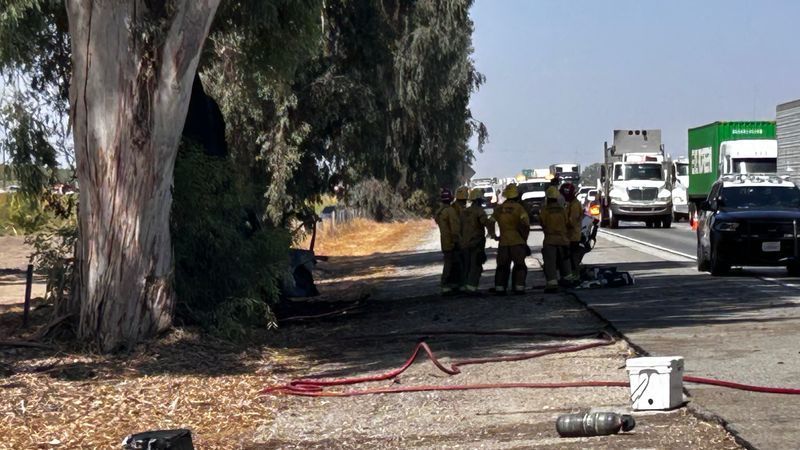 At least one person is dead after a truck struck a tree and caught on fire on Highway 99 Wednesday afternoon. PHOTO: KBAK/KBFX