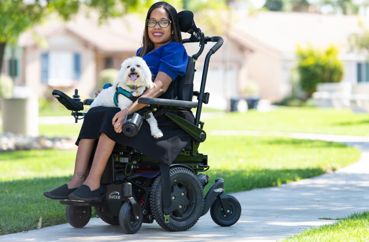 Children's literature author Charity Harris and her dog Teddy.