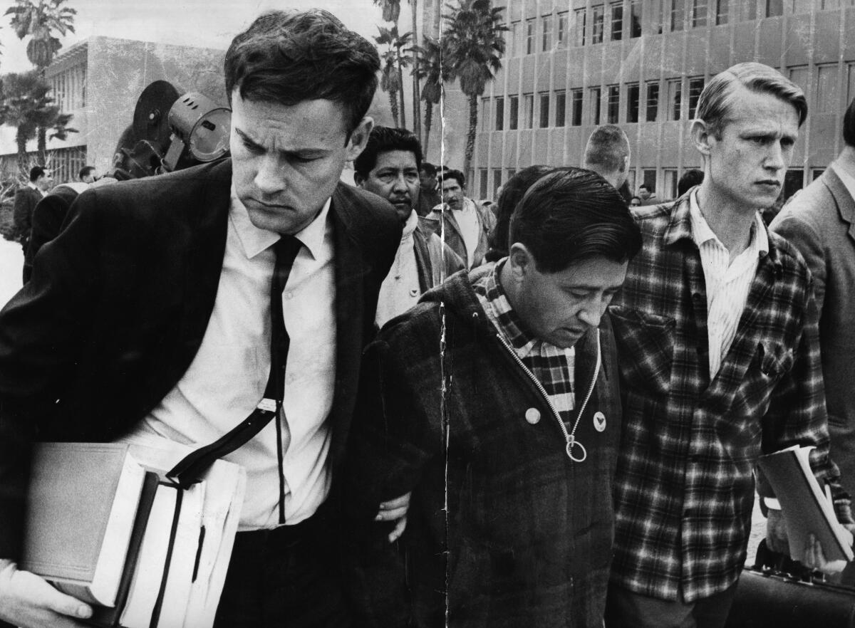 Cesar Chavez, head of farm workers union, with Jerry Cohen, left, union attorney, and Leroy Chatfield, a union aide.