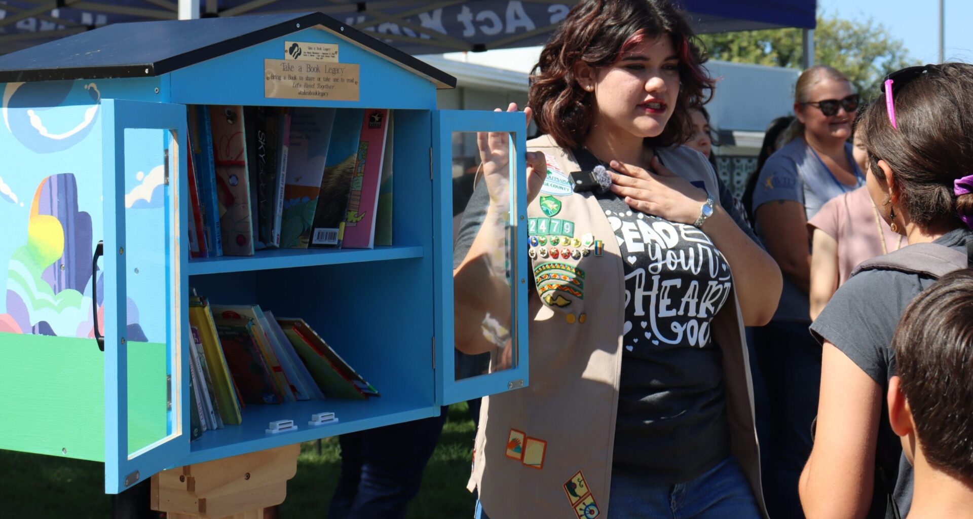 Former Centralia Elementary School District student Sarah Barron speaks to students at San Marino Elementary School about the new free library available on their campus. (Centralia Elementary School District)