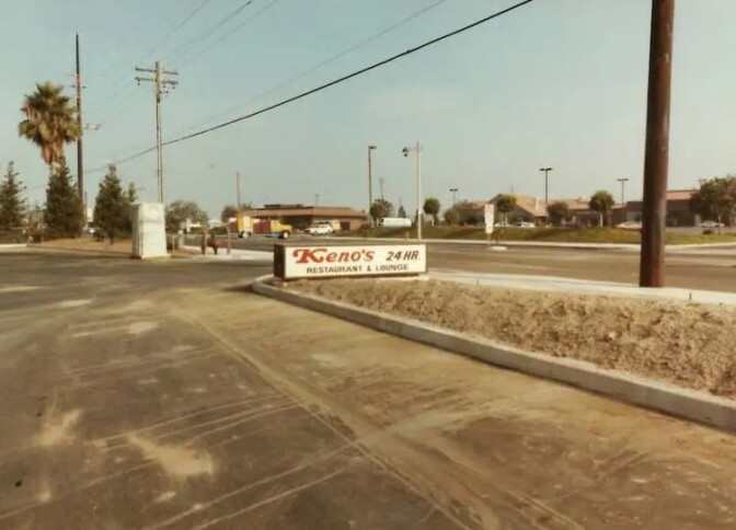 An old, developed photo of a restaurant sign
