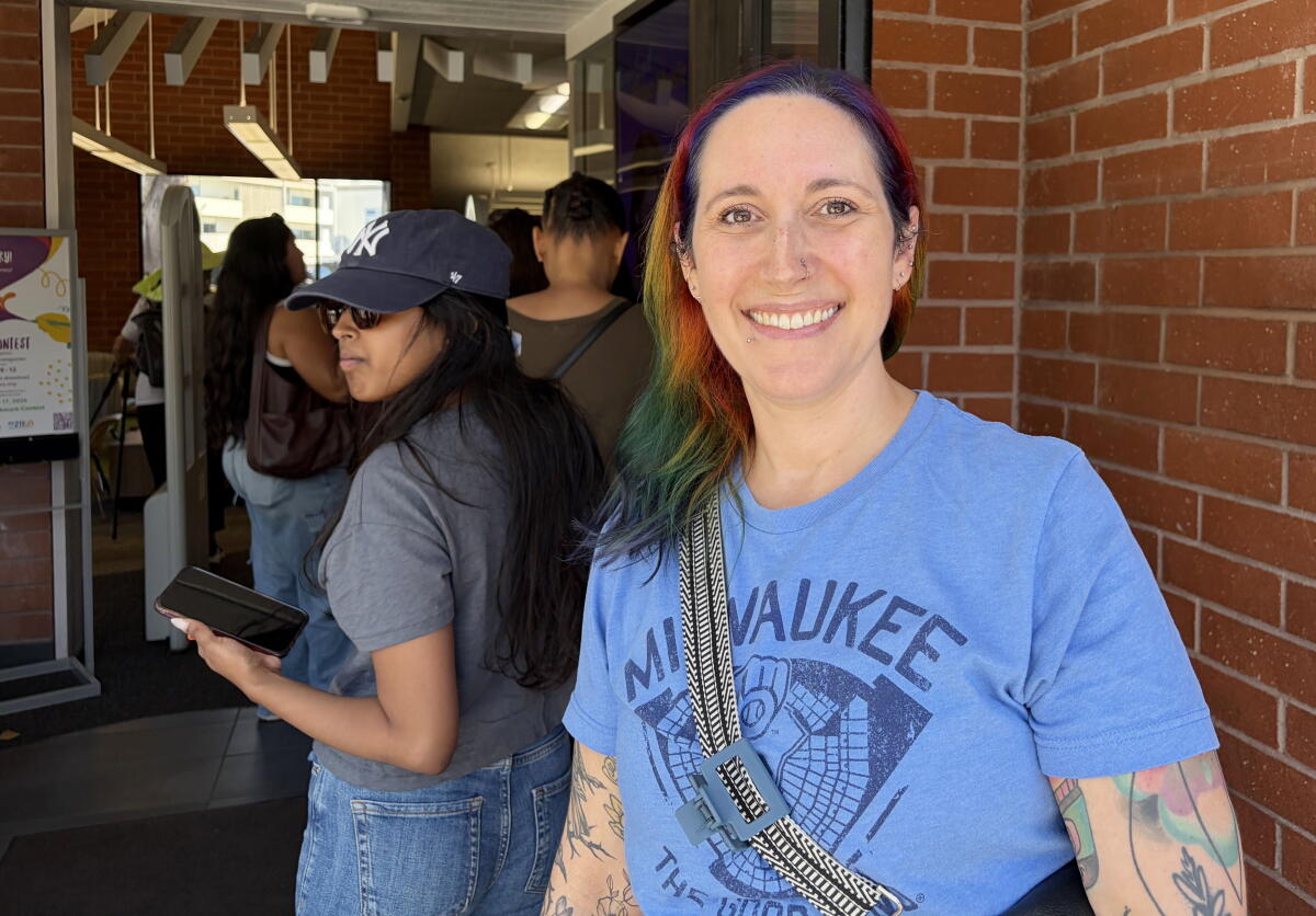 Rebecca Leach waits in line for the Hello Kitty L.A. County library card.