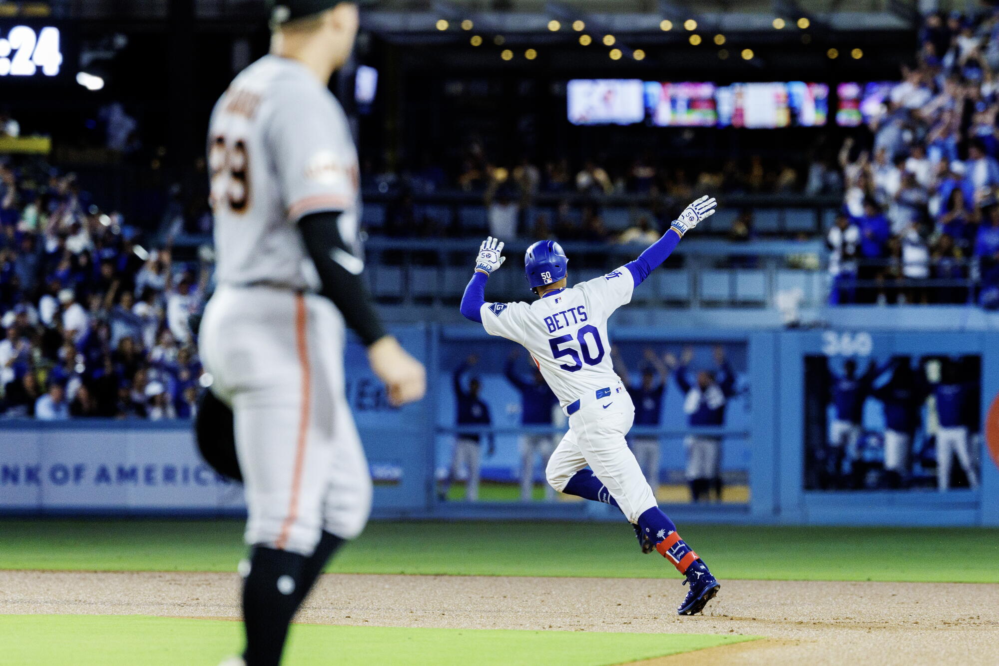Dodgers shortstop Mookie Betts celebrates after hitting a solo home run in the first inning Friday.