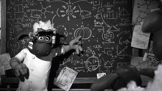 A black and white shot of a sheep pointing at a chalkboard filled with equations.