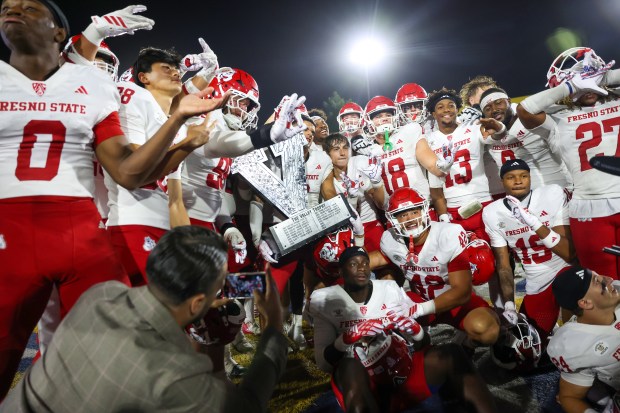 Fresno State celebrates with the Valley Trophy after winning against San Jose State Spartans at CEFCU Stadium in San Jose, Calif., on Saturday, Sept. 19, 2026. (Shae Hammond/Bay Area News Group)