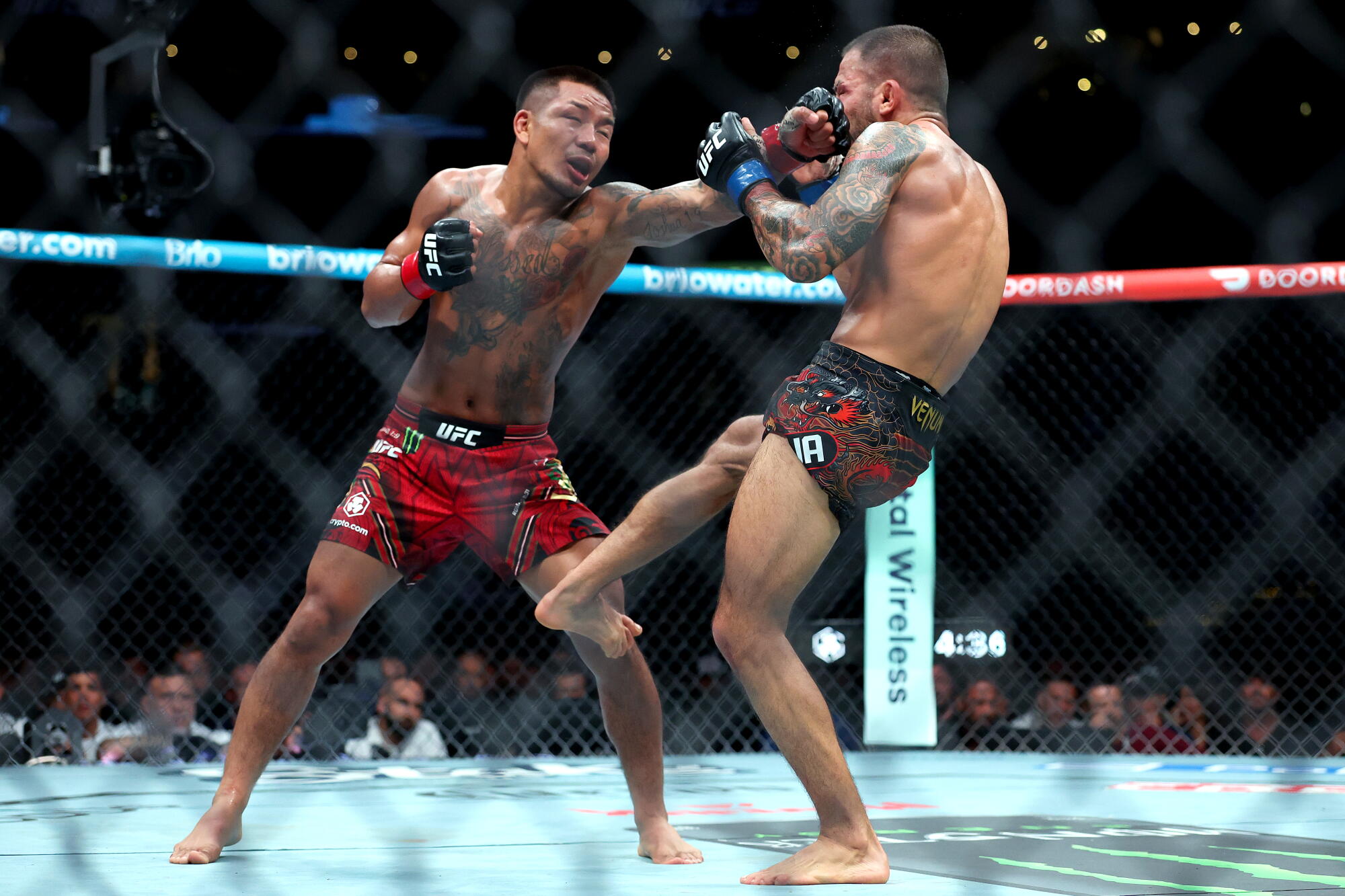 Joshua Van punches Alexandre Pantoja during their UFC 331 flyweight championship bout at Crypto.com Arena on Saturday.