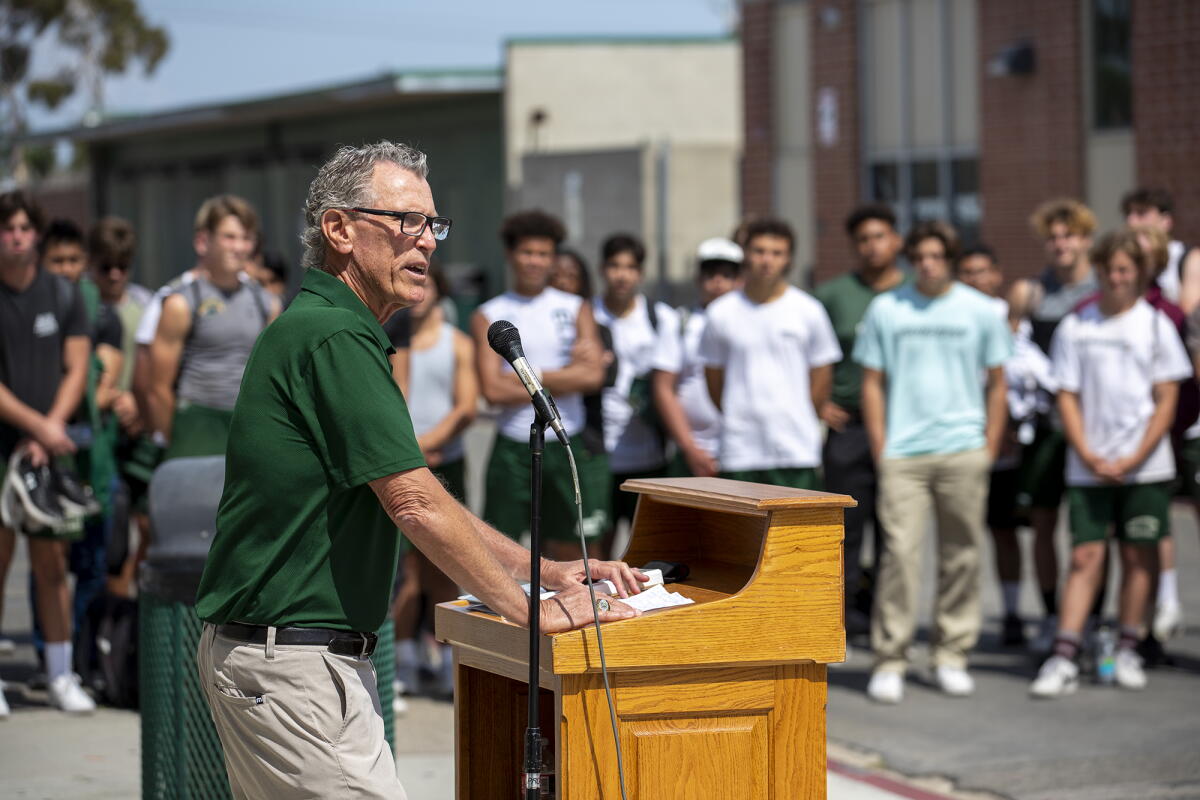 Dave White speaks to a crowd.