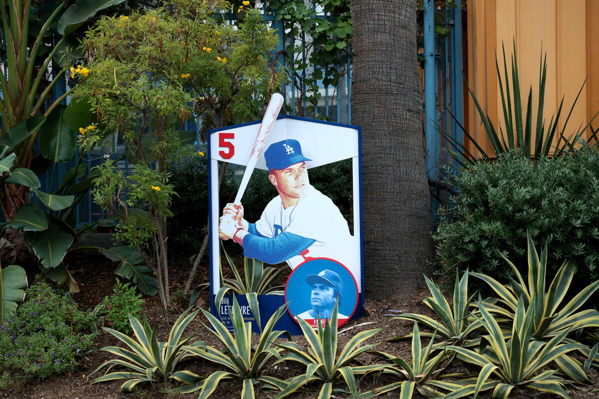 A photo of Jim Lefebvre, Dodger player from 1965-1972, is surrounded by plants at Dodger Stadium on Tuesday.