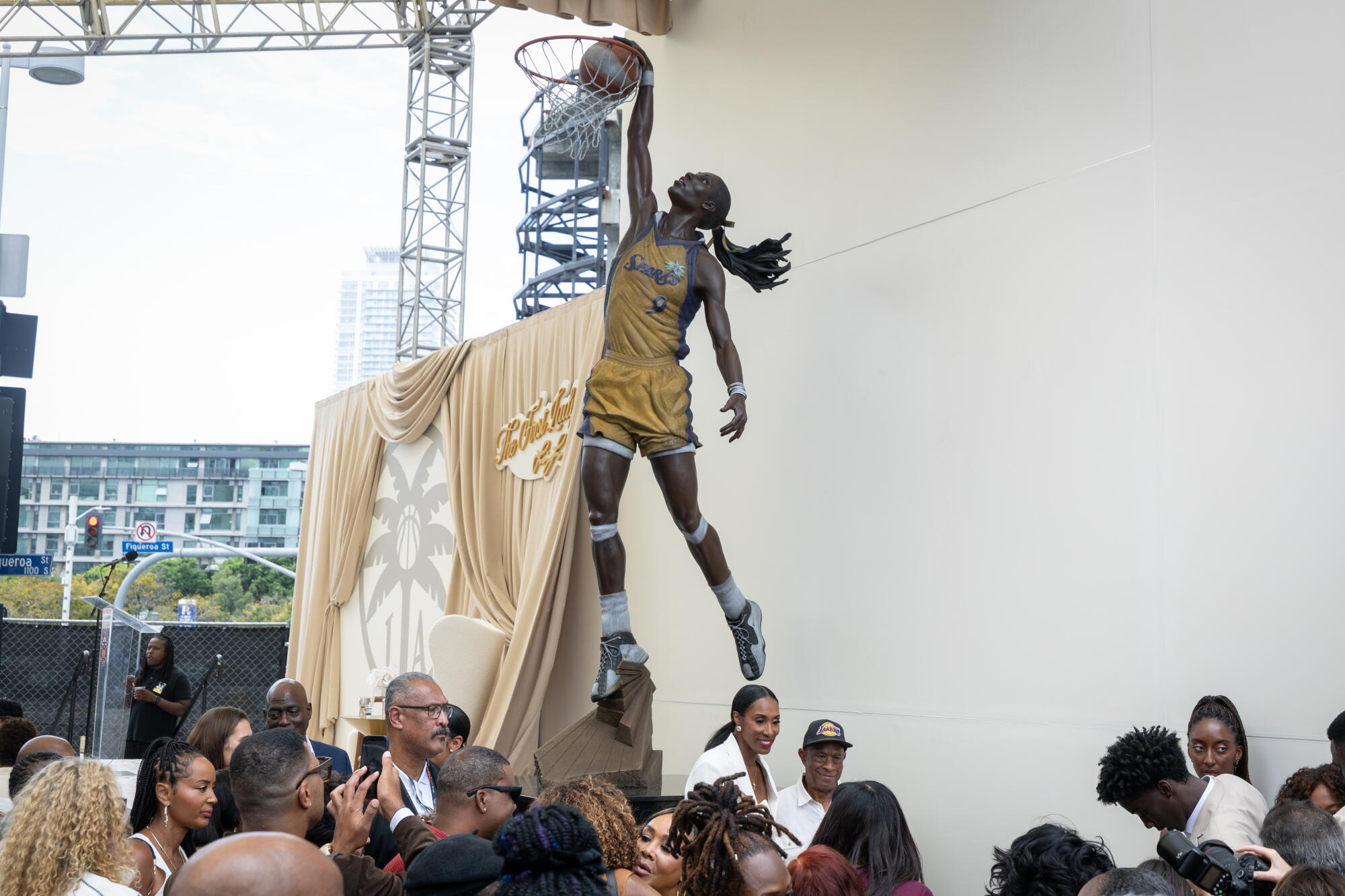 Sparks legend Lisa Leslie takes photos with family and friends at her statue unveiling outside Crypto.com Arena on Sunday.