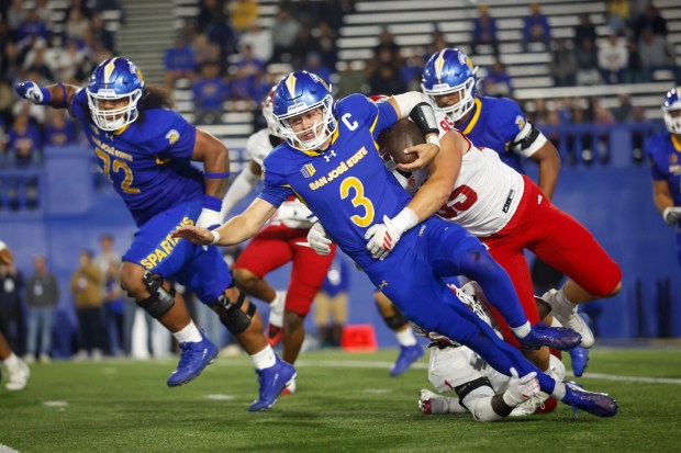 San Jose State Spartans' Luke Weaver (3) is tackled by Fresno State Bulldogs' Maverick Noonan (95) in the first quarter at CEFCU Stadium in San Jose, Calif., on Saturday, Sept. 19, 2026. (Shae Hammond/Bay Area News Group)