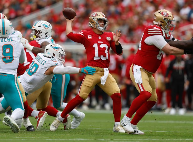 San Francisco 49ers starting quarterback Brock Purdy (13) throws under pressure against Miami Dolphins' Jacob Rodriguez (10) in the second quarter at Levi's Stadium in Santa Clara, Calif., on Sunday, Sept. 20, 2026. (Nhat V. Meyer/Bay Area News Group)