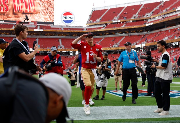 San Francisco 49ers starting quarterback Brock Purdy (13) salutes the crowd as he leaves the field following their 35-13 win over the Miami Dolphins at Levi's Stadium in Santa Clara, Calif., on Sunday, Sept. 20, 2026. (Nhat V. Meyer/Bay Area News Group)