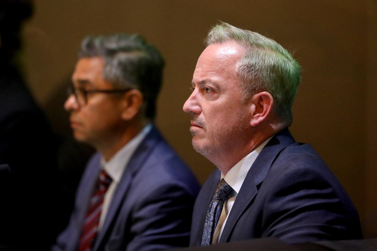 Former city manager Vanderpool flanked by current City Atty. Rob Fabela