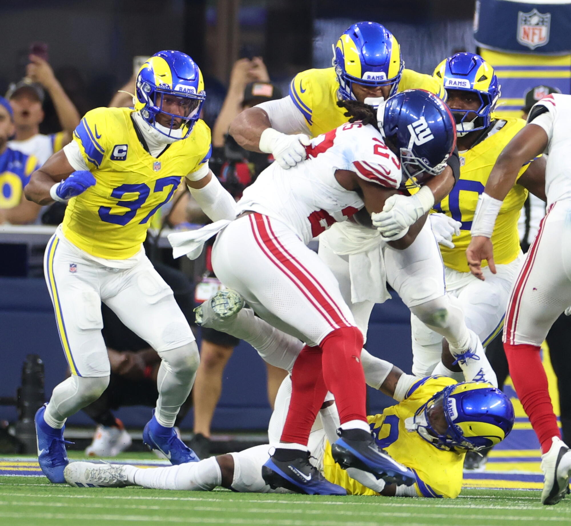 Rams defensive tackle Aaron Donald wraps up Giants running back Najee Harris.