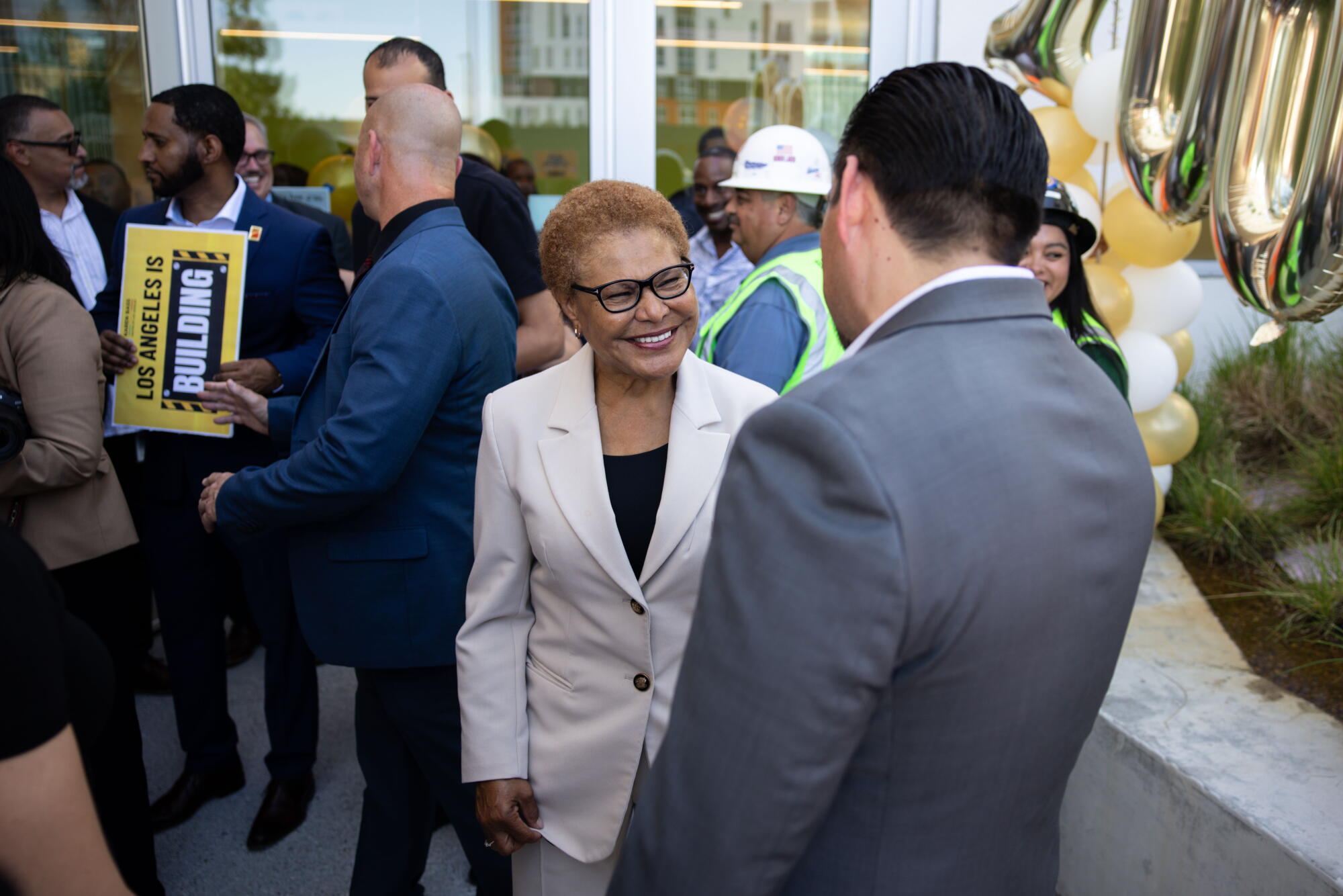 Mayor Karen Bass greets community members after speaking at Vermont/Santa Monica Metro Center.