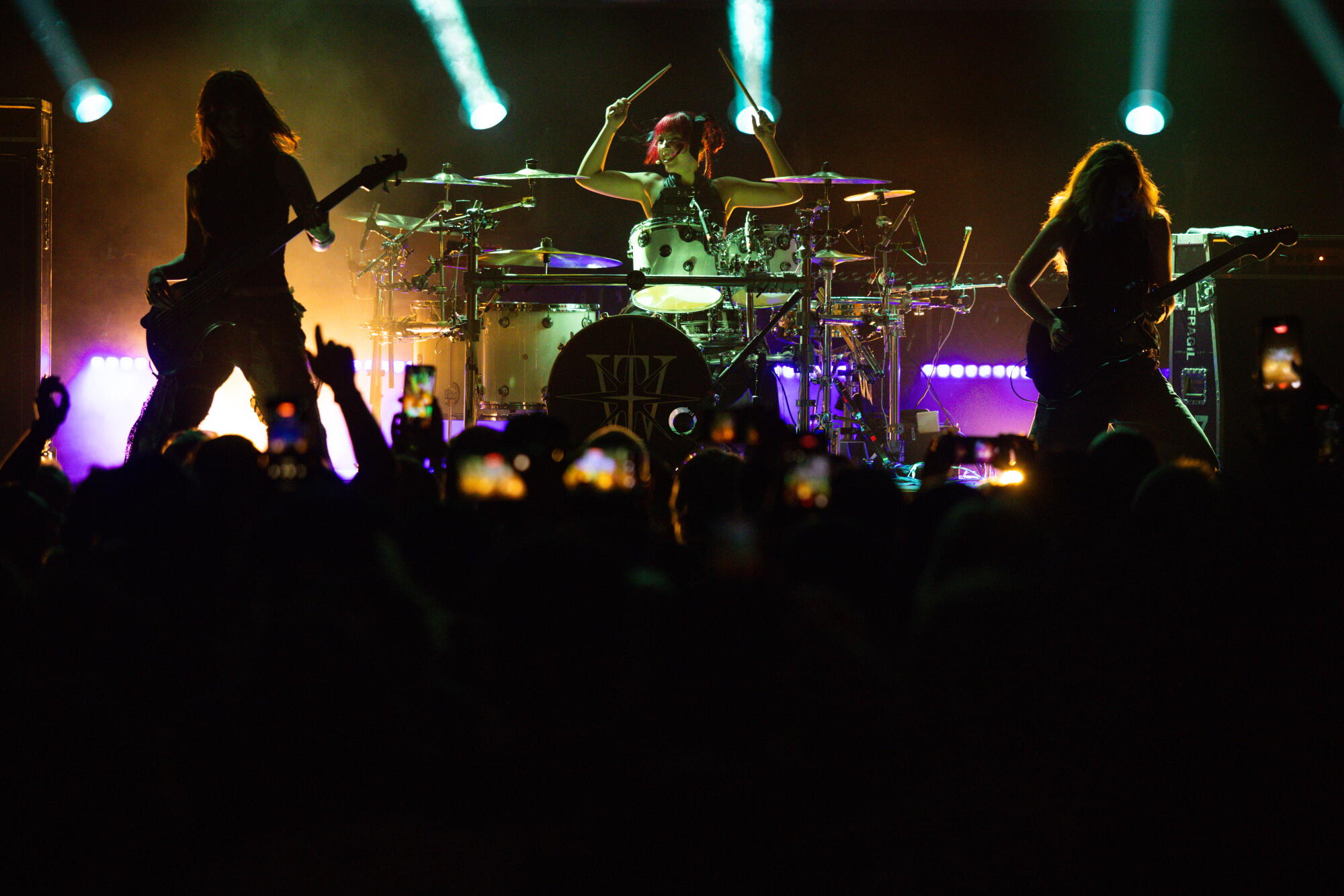 The Warning, members Alejandra Villarreal, left, Paulina Villarreal, center, and Daniela Villarreal, right, perform.