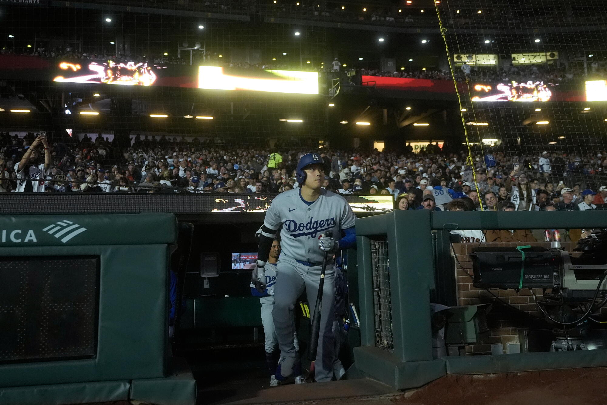 Dodgers star Shohei Ohtani takes the field at the start on Friday's game against the Giants.