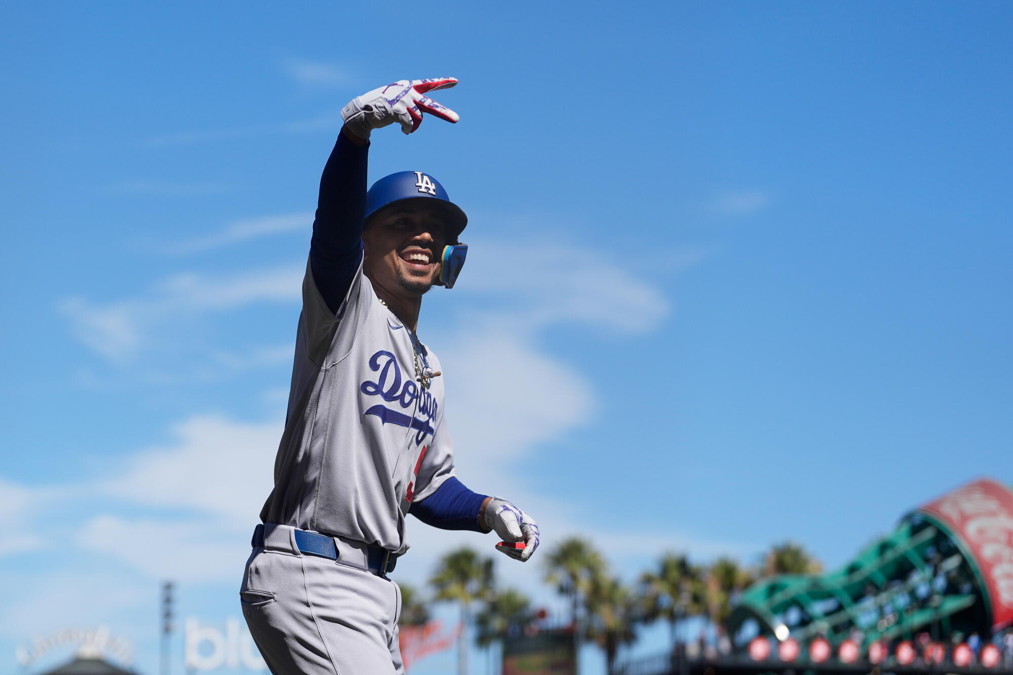 Mookie Betts celebrates after hitting a home run for the Dodgers in the third inning Saturday against the Giants.