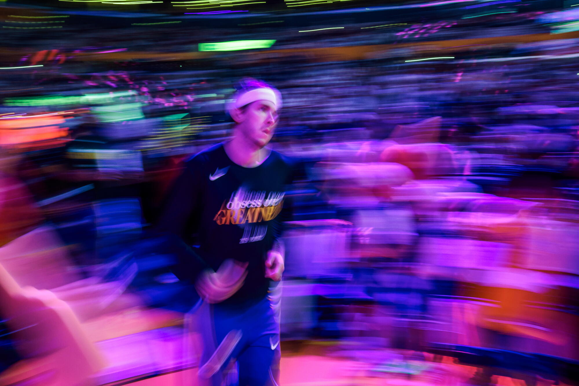 Lakers guard Austin Reaves runs onto the court before a playoff Game 3 against the Thunder.