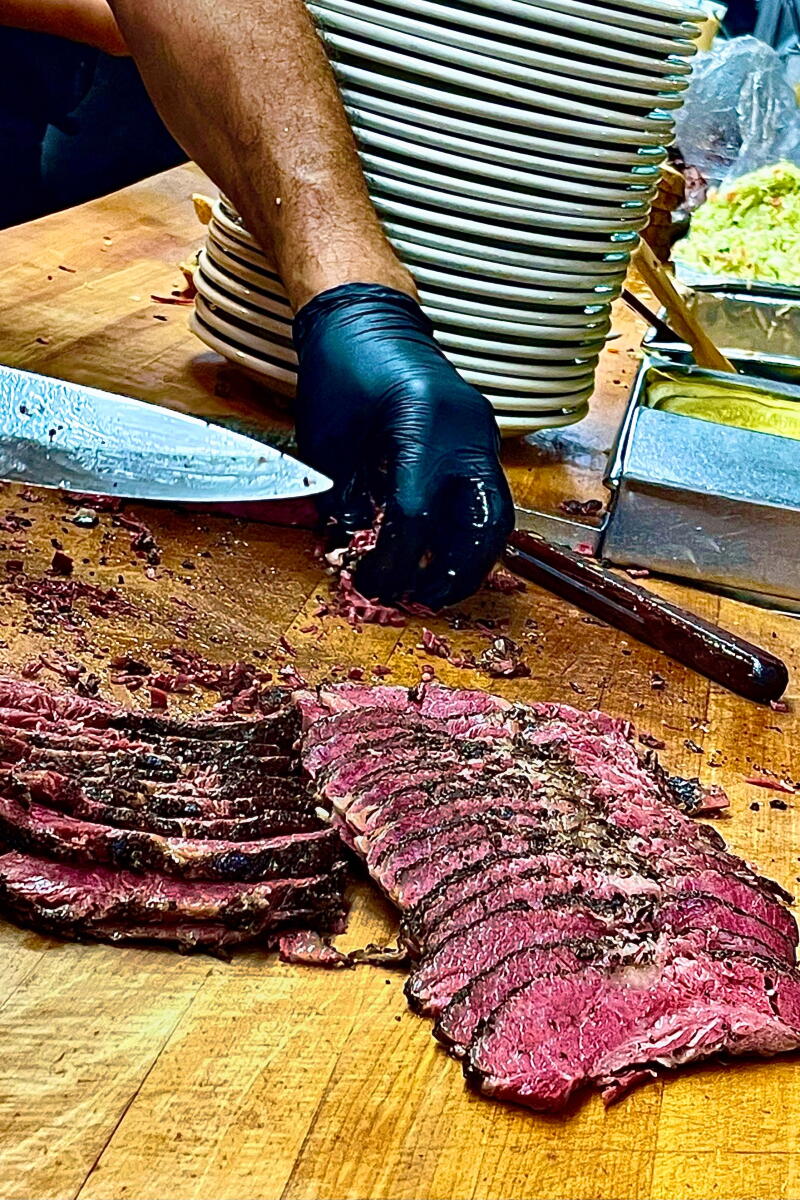 Jaime Castaneda hand-slices pastrami at Langer's Deli