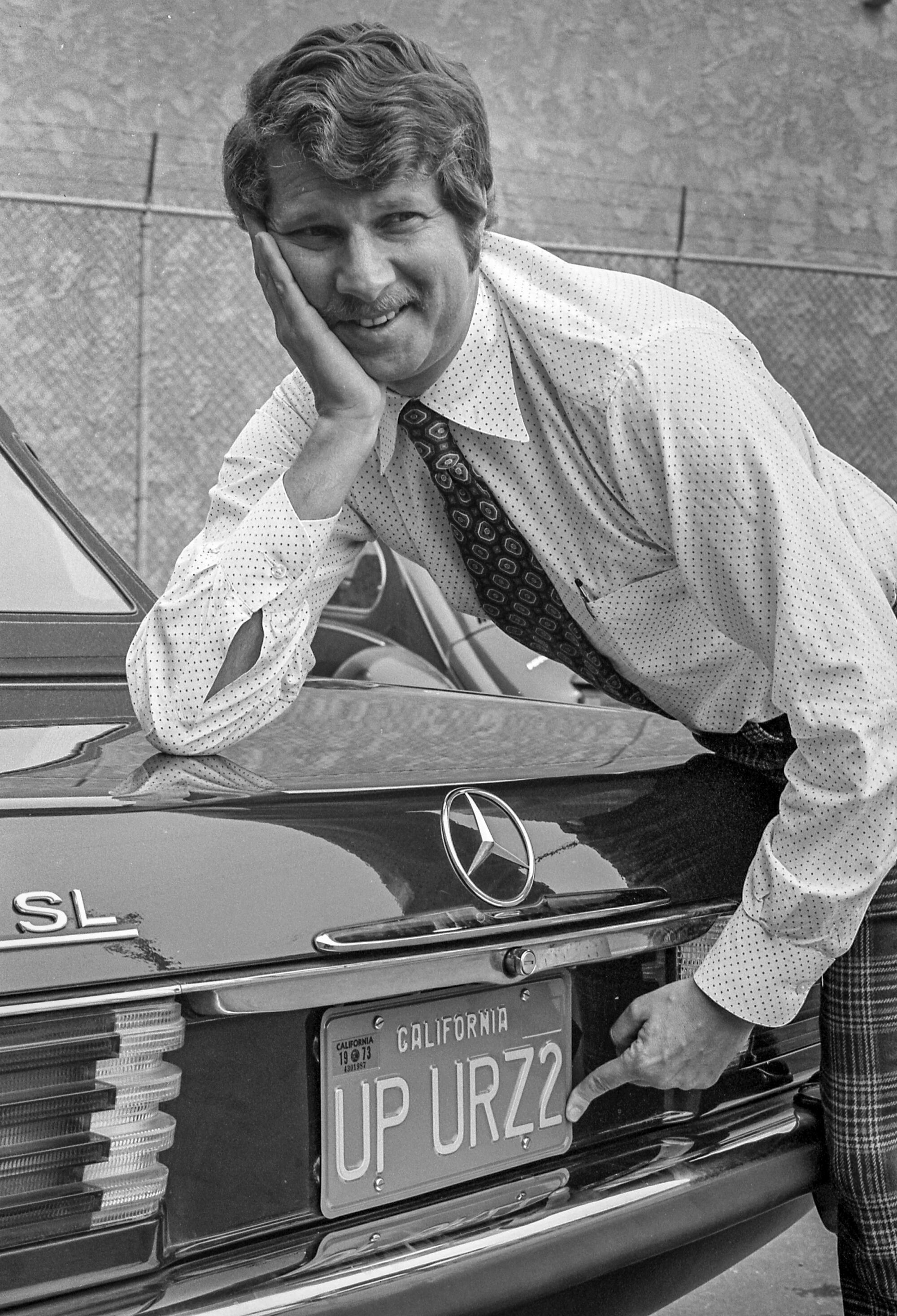 Burt Blum with his personalized license plate the Department of Motor Vehicles wanted to recall.