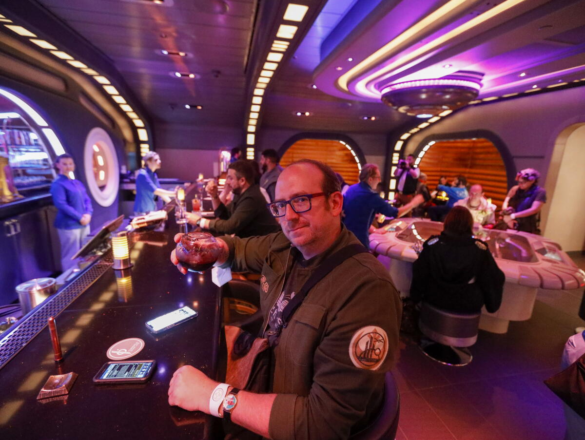 Me, enjoying a beverage, on the now shuttered Star Wars: Galactic Starcruiser.