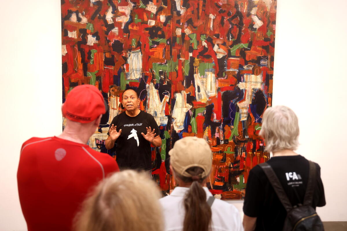 Famed Chicano painter Gronk discusses his work with Santa Monica College students.