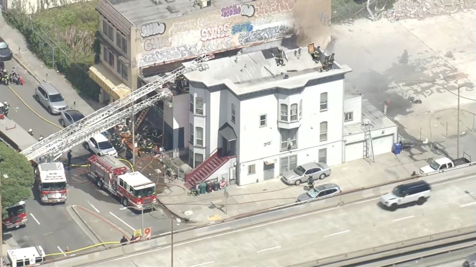 Oakland firefighters knock down multi-building fire on Webster Street between 6th and 7th, authorities say