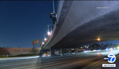 Corvette hangs from 5 Freeway overpass after Anaheim crash