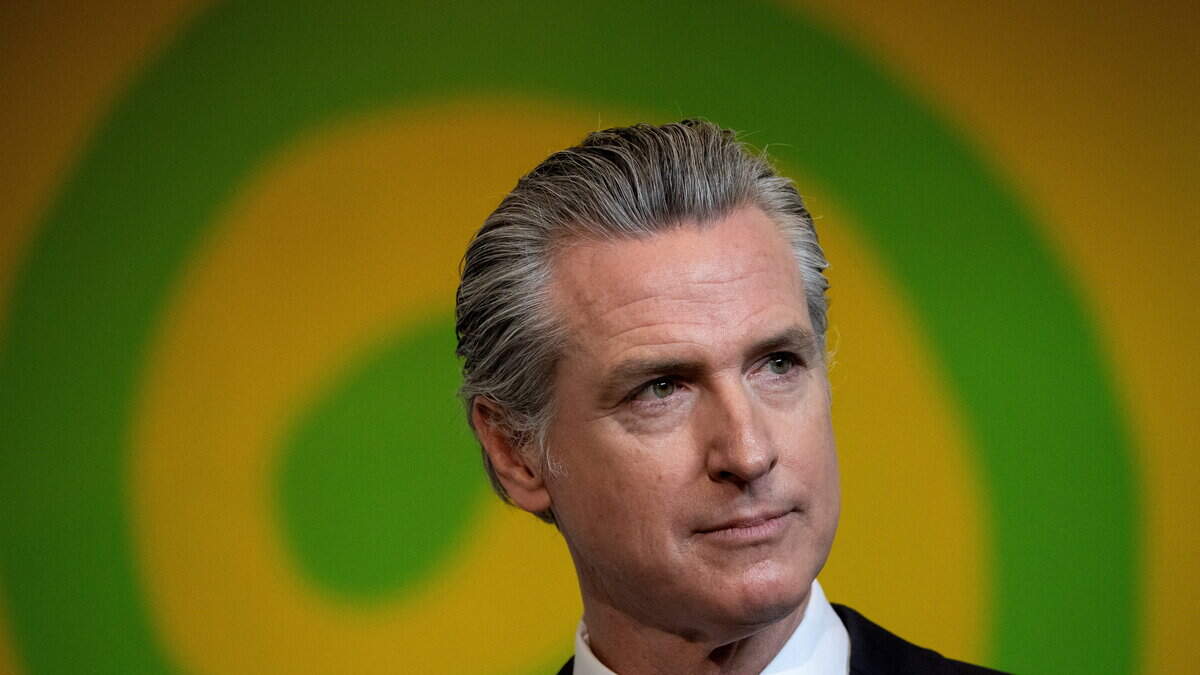 California Gov. Gavin Newsom looks on as he holds a press conference in San Francisco. Newsom announced California’s intent to sue the Trump administration on Monday.