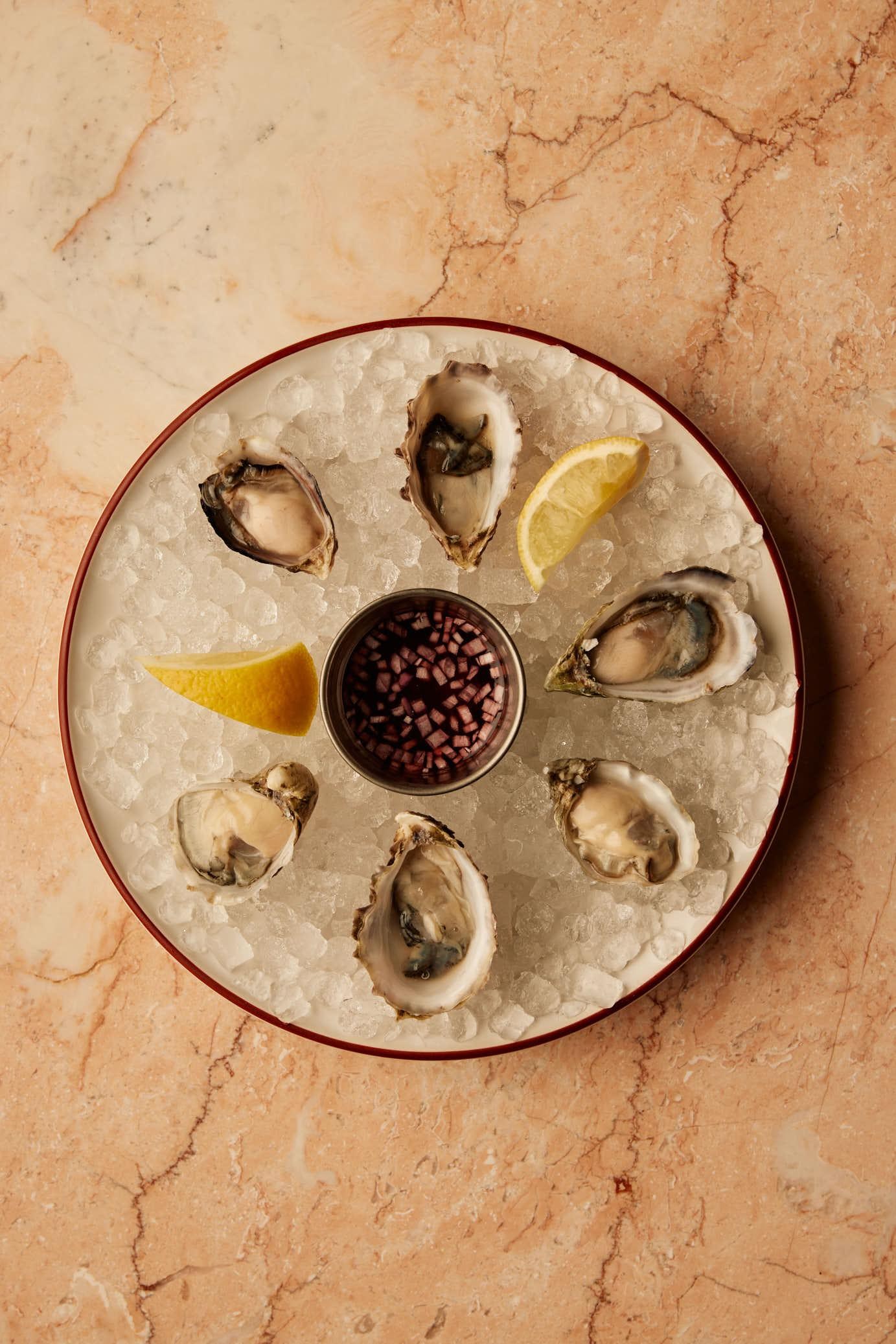 Oysters with an Espelette pepper–seasoned rim on the shell along with a seasonal mignonette at Sous Sous restaurant in Silver Lake.