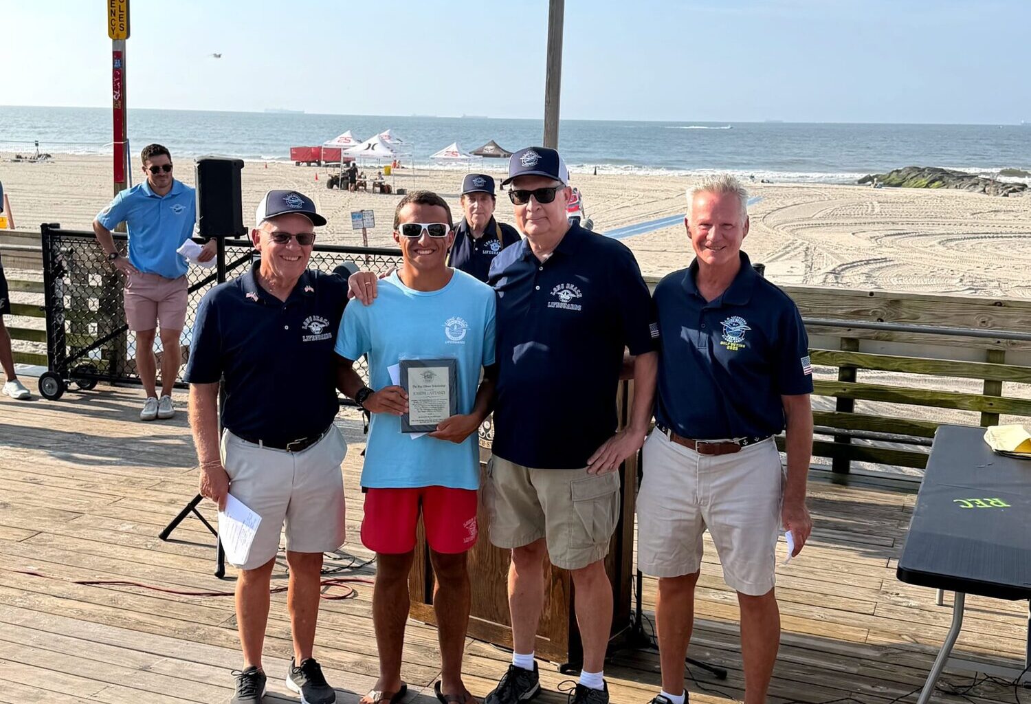 L.B. Lifeguard Alumni Association&rsquo;s president, Mike DeLury, far left, joined Joseph Lattanzi, Vice President Dan Michaelis and Treasurer Joseph Hamlet in the presentation.