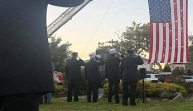 Members of the Long Beach Fire Department conducted a fire department flag arch, a ceremonial display, to honor those who died on Sept. 11, 2001.