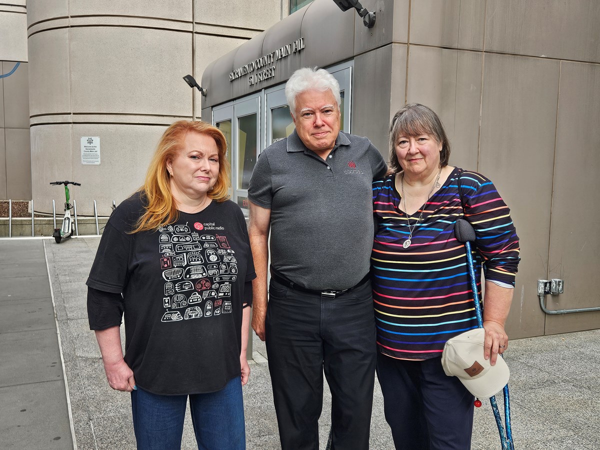 Former CapRadio employees Patti Stoltz (left) and Mark Jones (center) and former volunteer Joey Jones (right) stand outside the Sacramento County Main Jail Thursday, Sept. 17, 2026.