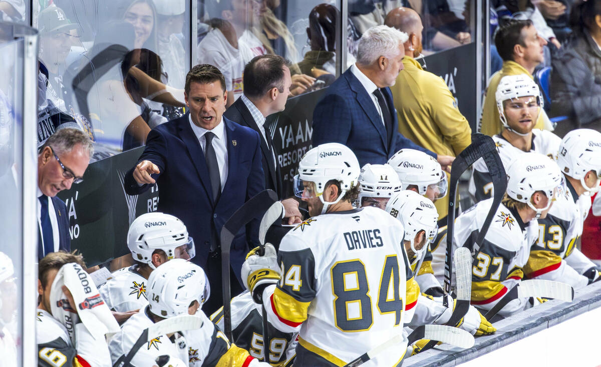 Golden Knights head coach Ryan Craig has instructions for players on timeout during the first p ...