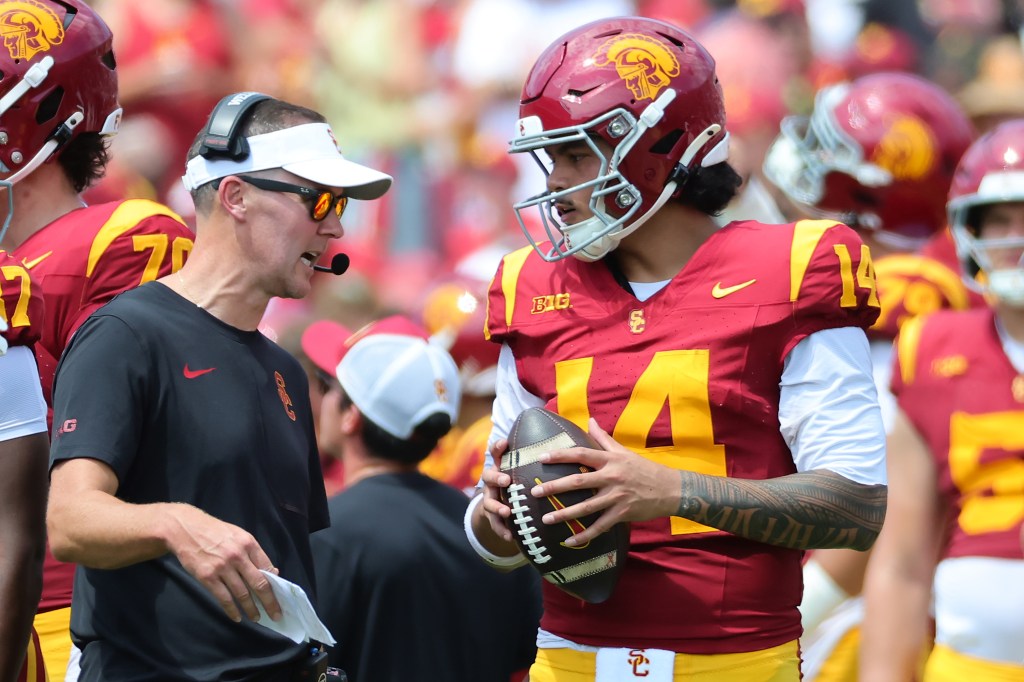 USC coach Lincoln Riley talks to quarterback Caleb Williams during the San Jose State game.