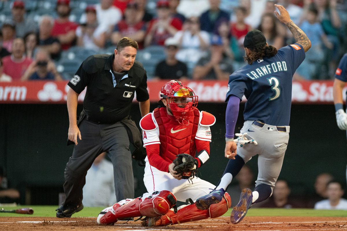 Seattle Mariners short stop J.P. Crawford (3) slides home and is tagged out during an MLB match between Seattle Mariners and Los Angeles Angels on Monday, September 14, 2026 at Angel Stadium in Anaheim, California.