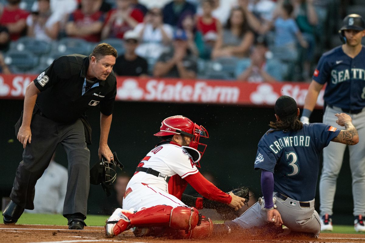Seattle Mariners short stop J.P. Crawford (3) slides home and is tagged out during an MLB match between Seattle Mariners and Los Angeles Angels on Monday, September 14, 2026 at Angel Stadium in Anaheim, California.