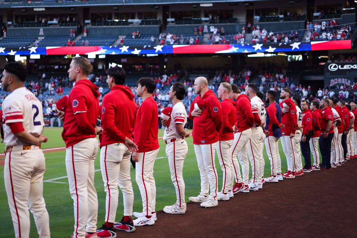 Los Angeles Angels stand for the national anthem before the MLB game against the Seattle Mariners Tuesday September 15th, 2026 at Angel Stadium in Anaheim, Calif.