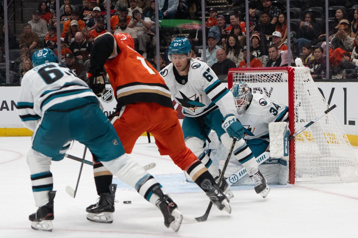 San Jose Sharks goalie Matthew Davis (34) protects the net as players hustle for possession during an NHL match between San Jose Sharks and Anaheim Ducks on Sunday, September 20, 2026 at Honda Center in Anaheim, California. San Jose Sharks goalie Matthew Davis (34) protects the net as players hustle for possession during an NHL match between San Jose Sharks and Anaheim Ducks on Sunday, September 20, 2026 at Honda Center in Anaheim, California.