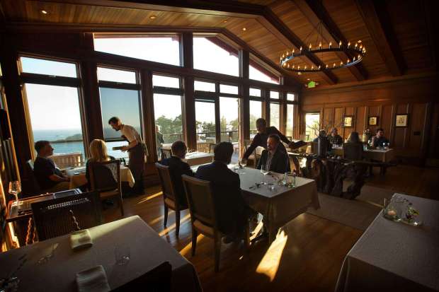 The remodeled dining room at the Harbor House in Elk uses the warmth of redwood found in groves along the Mendocino coast. (John Burgess/The Press Democrat)