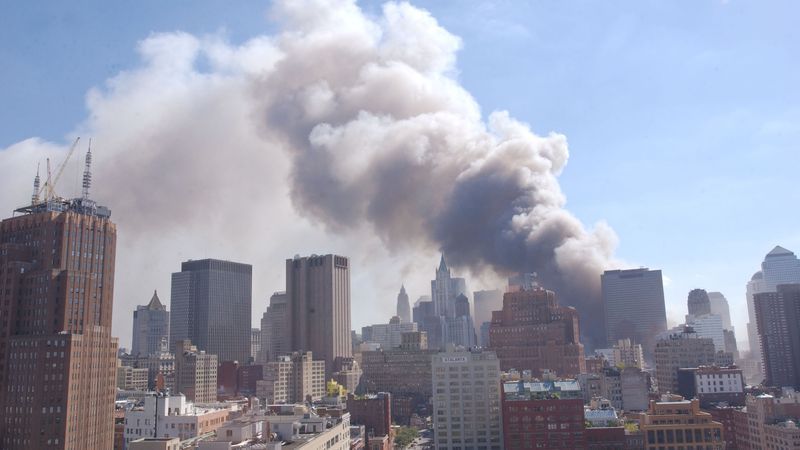 Dust swirls around south Manhattan after a tower of the World Trade Center collapses September 11, 2001 in New York City after two airplanes slammed into the twin towers in a terrorist attack. (Photo by Spencer Platt/Getty Images)