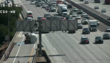 Overturned big rig spills diesel, prompting road closure on Highway 50