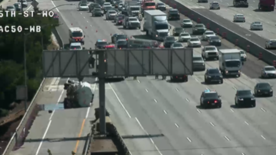 Overturned big rig spills diesel, prompting road closure on Highway 50