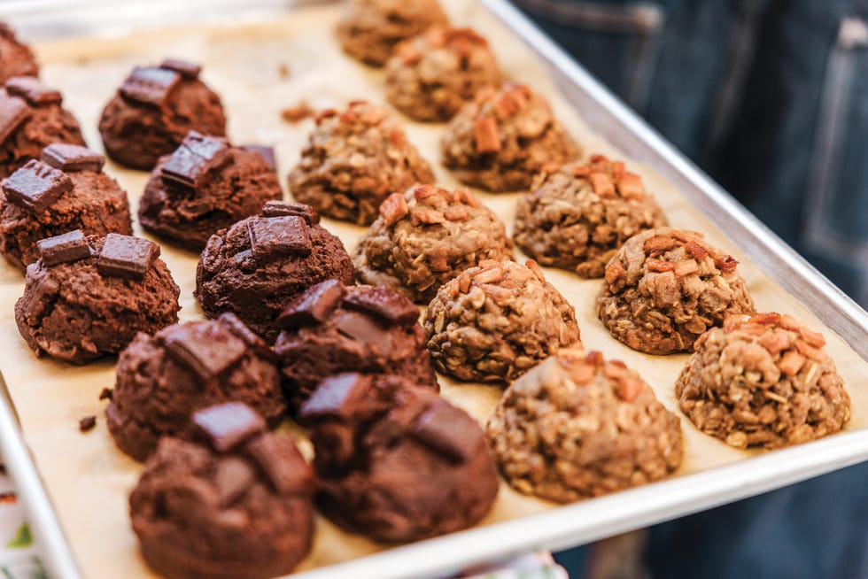 tray of baked chocolate and oatmeal cookies with toppings, het say, san jose california, mekong dark chocolate cookies.