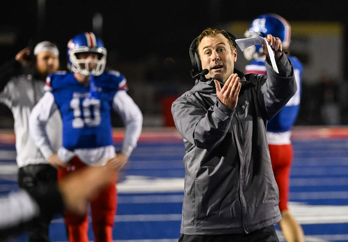 Folsom Bulldogs coach Paul Doherty calls a timeout after running the clock down at the end of the fourth quarter against the Riordan Crusaders In a CIF Northern California Regional Division 1-AA football championship game in Folsom on Friday, Dec. 5.