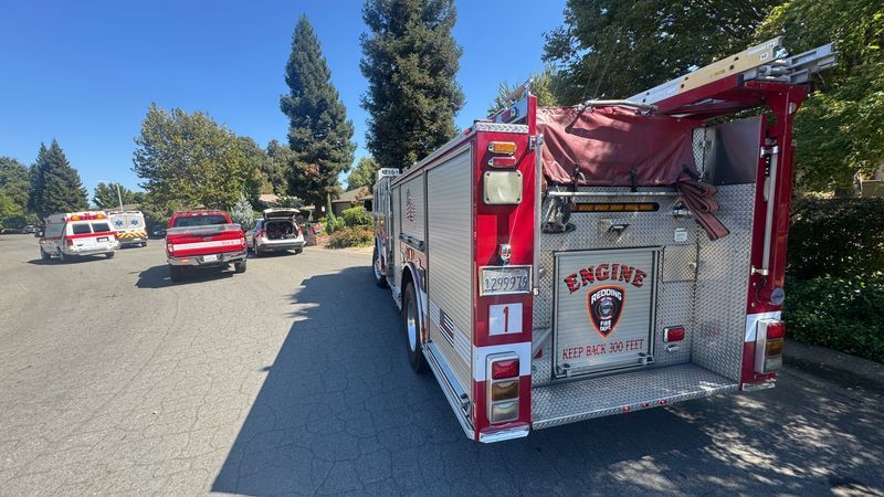 Emergency crews on Riverview Drive in Redding, Calif., while at the scene of a rescue of two kayakers who became stranded on a rock bar after overturning on rapids while on the Sacramento River on Friday, Sept. 18, 2026. (KRCR Chief Photographer Adam McAllister)
