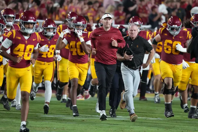 Sep 4, 2026; Los Angeles, California, USA; Southern California Trojans head coach Lincoln Riley leaves the field against the Fresno State Bulldogs in the first half at United Airlines Field at Los Angeles Memorial Coliseum. Mandatory Credit: Kirby Lee-Imagn Images