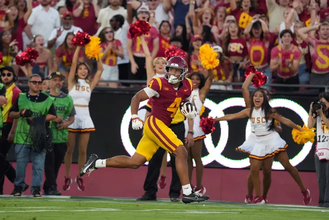 Sep 4, 2026; Los Angeles, California, USA; Southern California Trojans wide receiver Trent Mosley (4) s cores on a 68-yard touchdown reception against the Fresno State Bulldogs in the first half at United Airlines Field at Los Angeles Memorial Coliseum. Mandatory Credit: Kirby Lee-Imagn Images